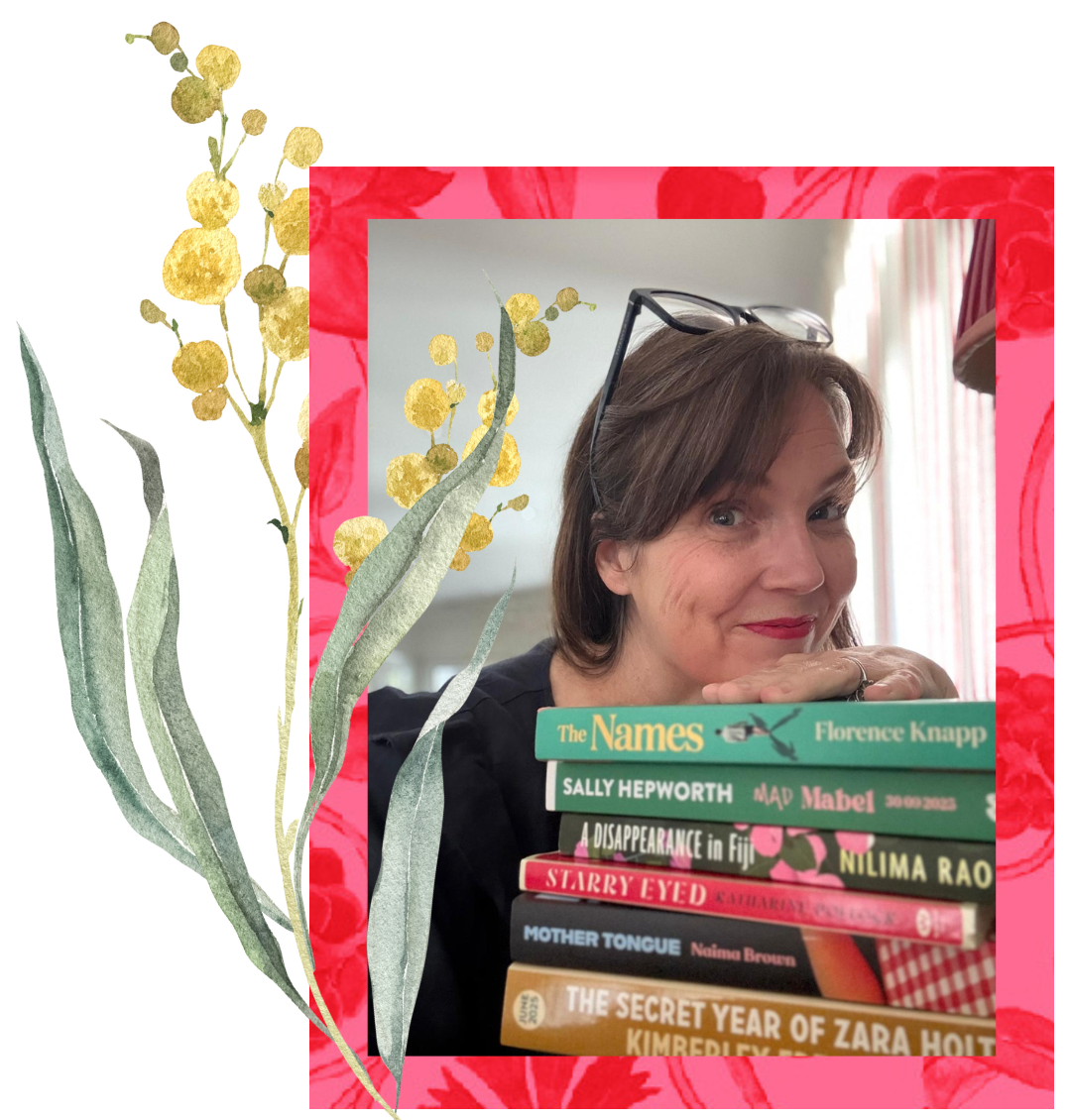 Bec Sparrow is smiling with her chin resting on a pile of Birds of a Feather books.